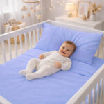 Juego de sábanas azul con bordado para cunas