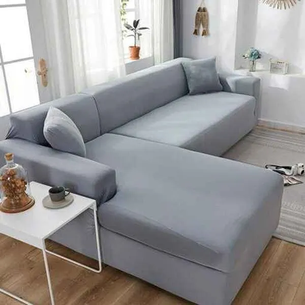 Funda elástica gris ajustable para sofá esquinero o sala moderna
